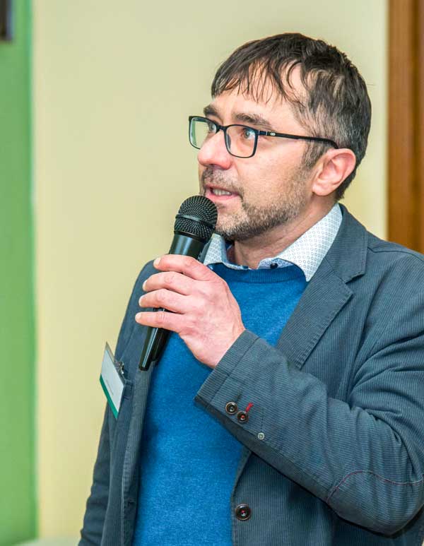 Portrait of Pavel Hložek at a conference